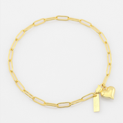Gold chain bracelet with heart and rectangular tag charm on a white background