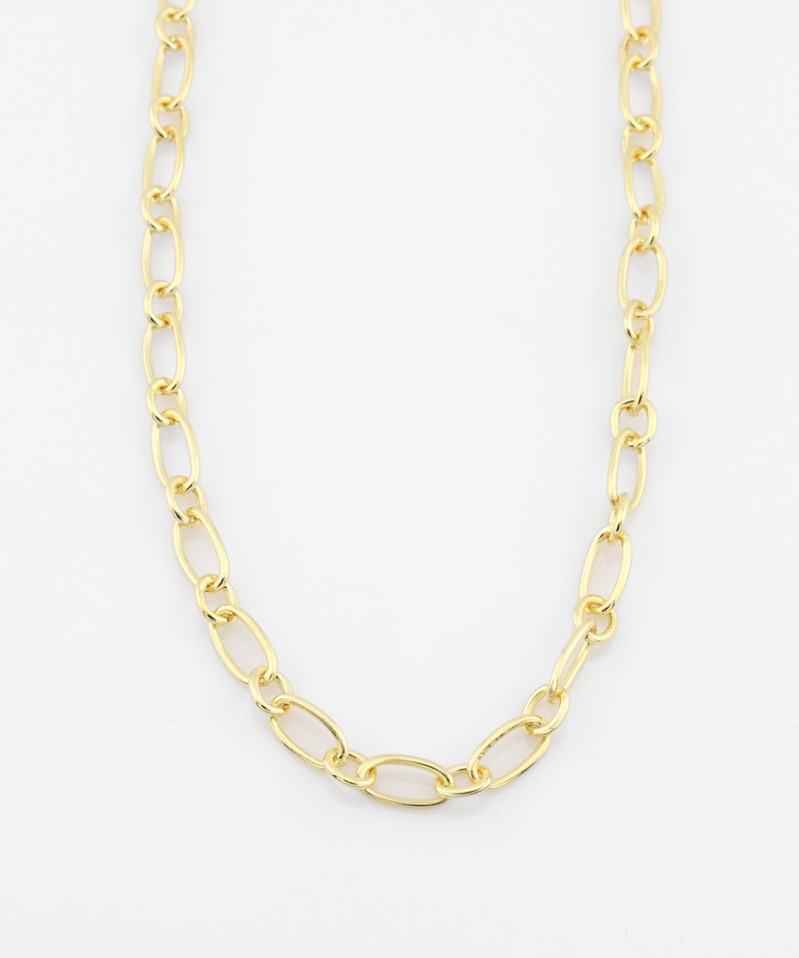 Gold chain necklace on a white background