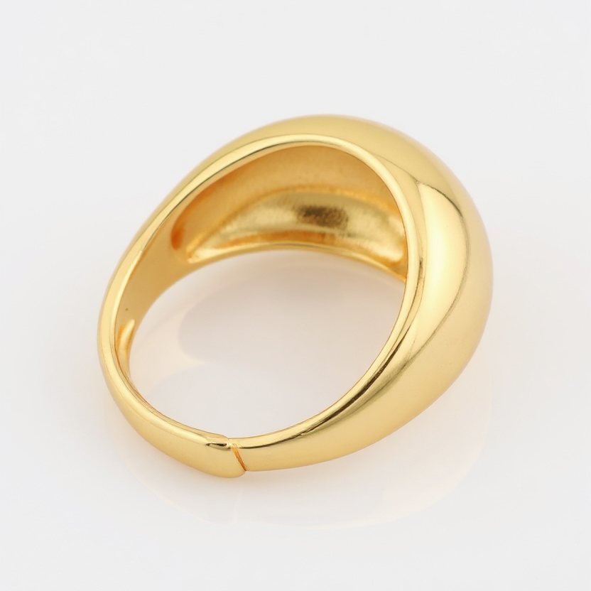 Gold ring on a light gray background