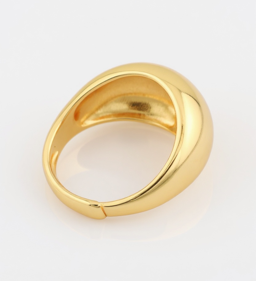 Gold ring on a light gray background
