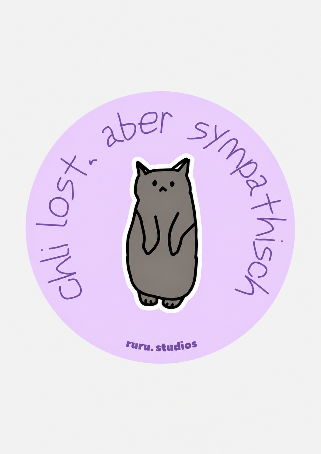 A circular sticker or decal with a light purple background, featuring a cartoon gray cat in the center and handwritten text reading 'chli lost, aber sympathisch' around the edge, with 'ruru.studios' at the bottom.