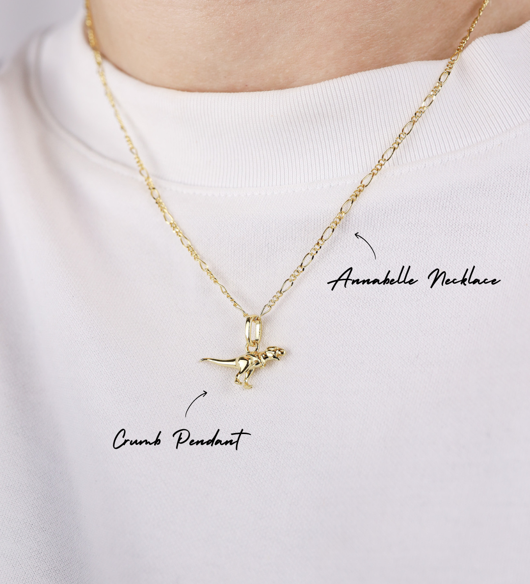 Gold necklace with a pendant on a white background