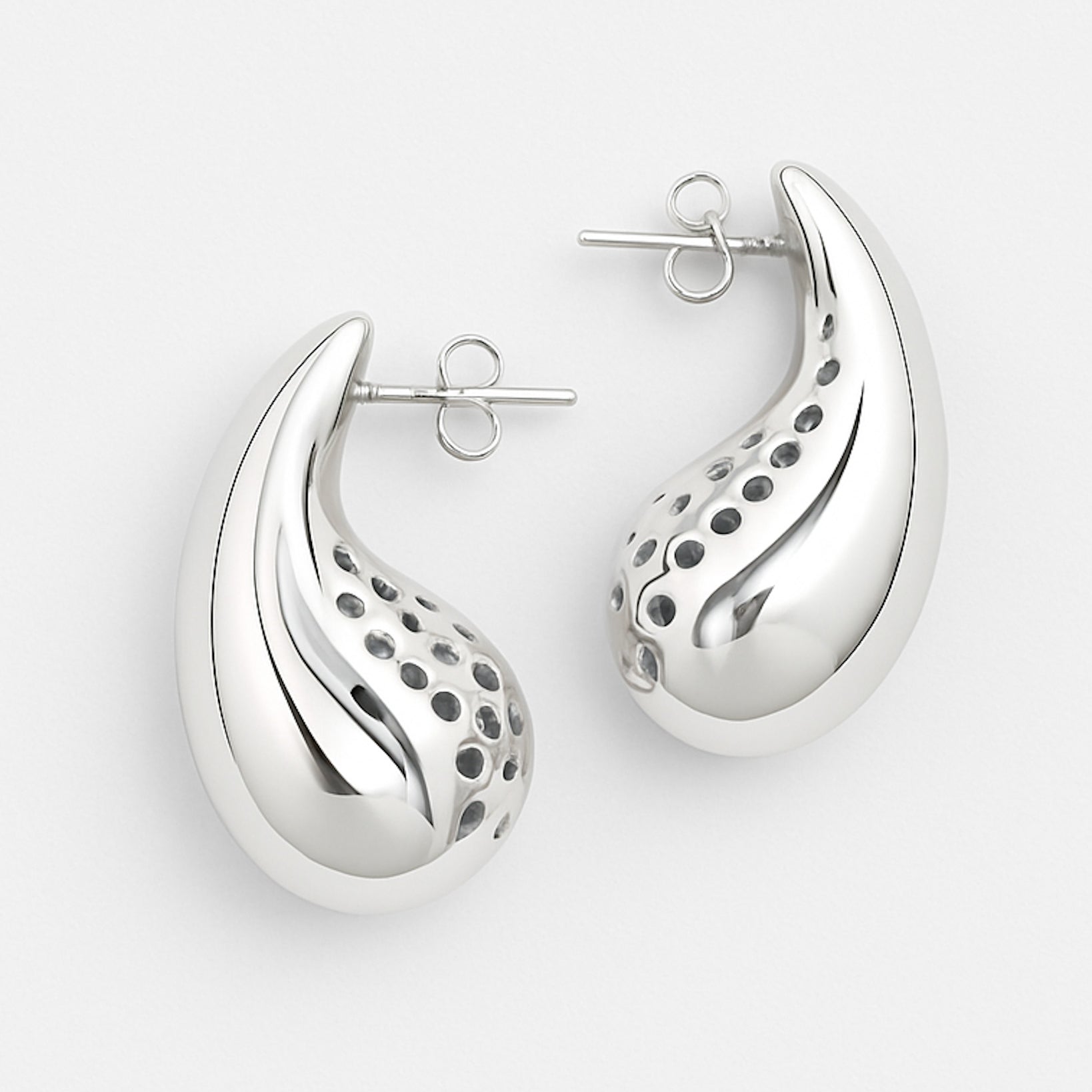 Silver earrings with a unique design on a white background