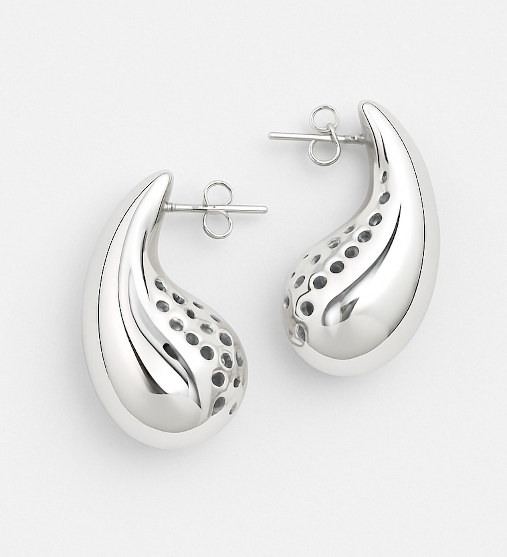 Silver earrings with a unique design on a white background