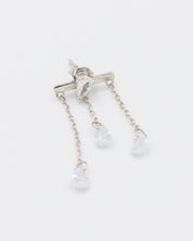 A pair of silver earrings with a stud closure and dangling chain detailed with small clear crystals.