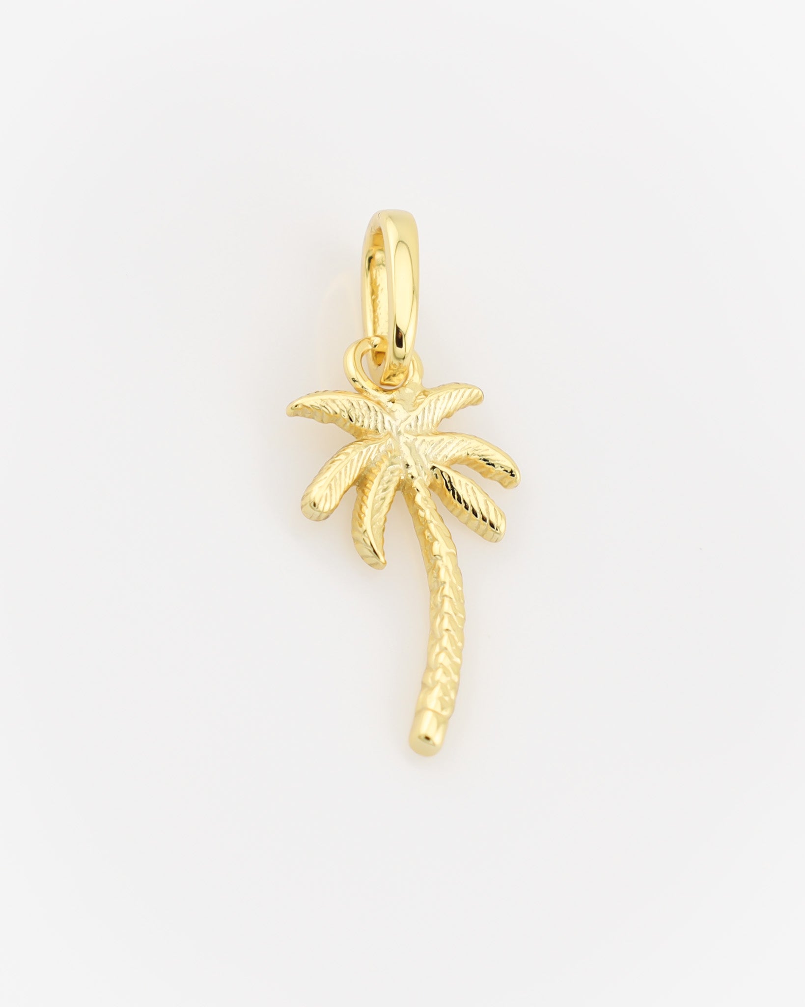 Gold palm tree pendant on a light gray background