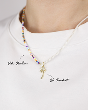 Necklace with a palm tree pendant on a white background