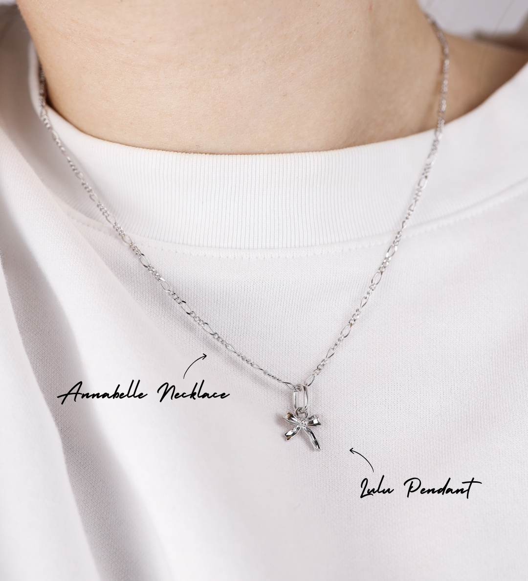 Silver necklace with a pendant on a white background