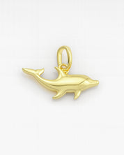Gold dolphin pendant on a white background