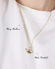 Gold necklace with a pendant on a white background