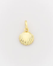 Gold shell pendant on a light gray background
