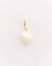 Gold pendant with a pearl on a light gray background