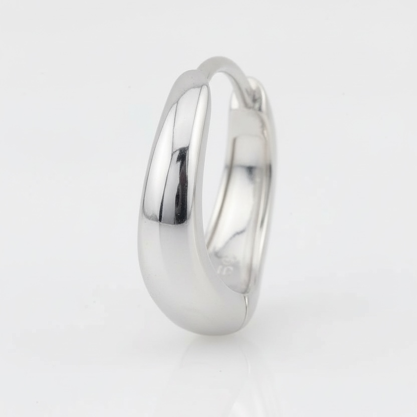 Silver ring on a light gray background