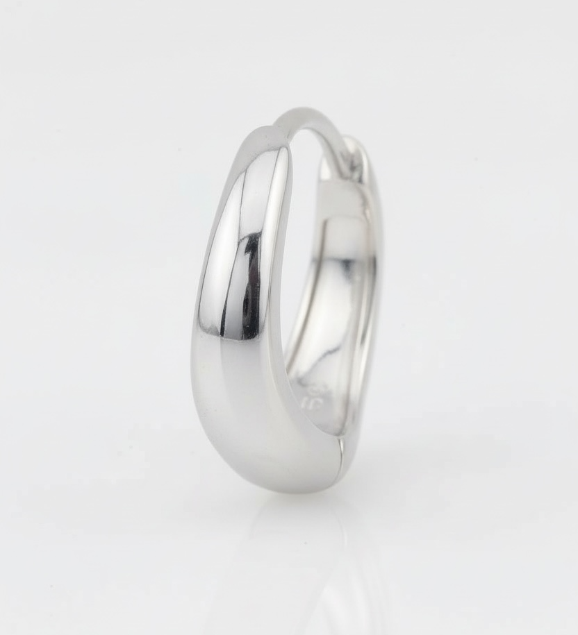 Silver ring on a light gray background