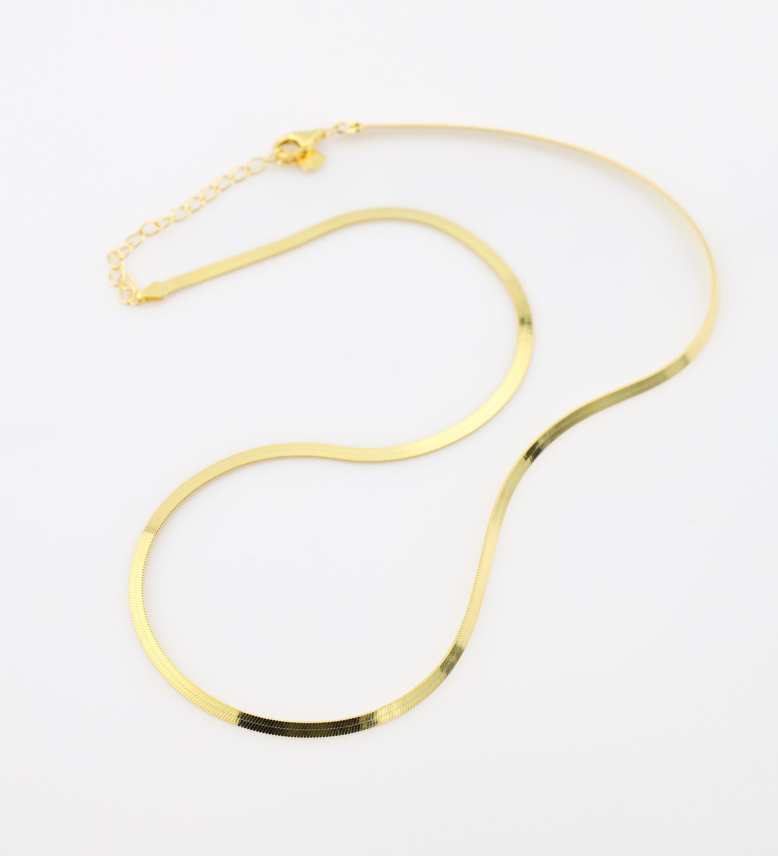 Gold necklace on a white background