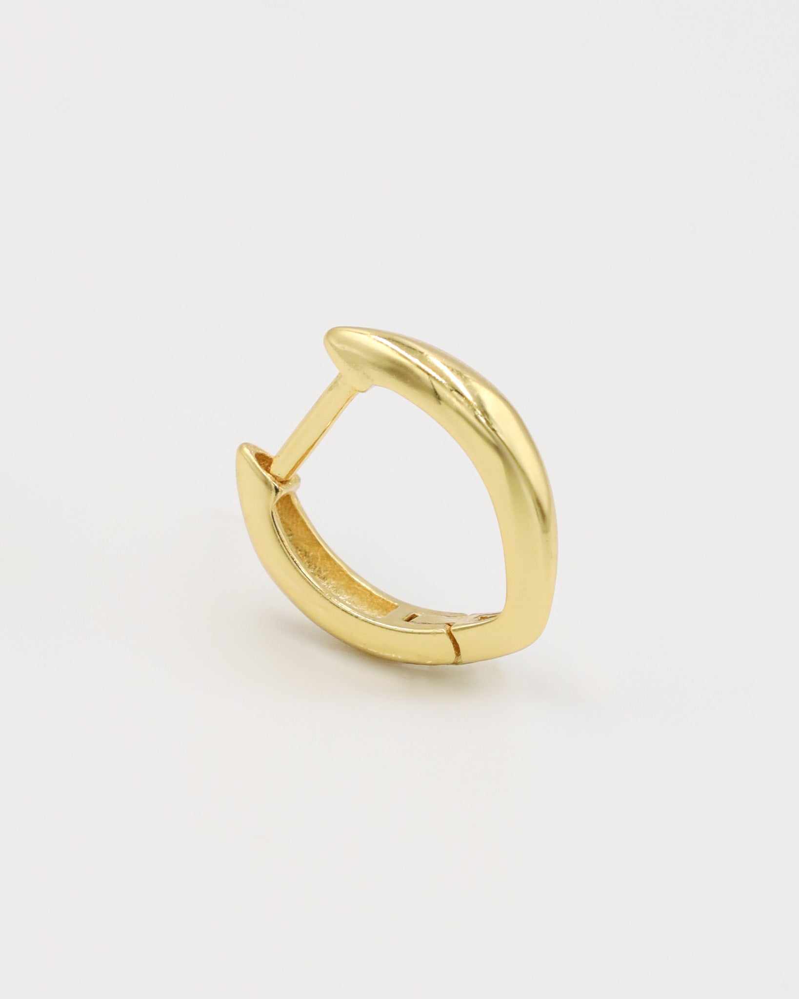 A single gold-colored hoop earring with a hinged clasp, displayed against a white background.