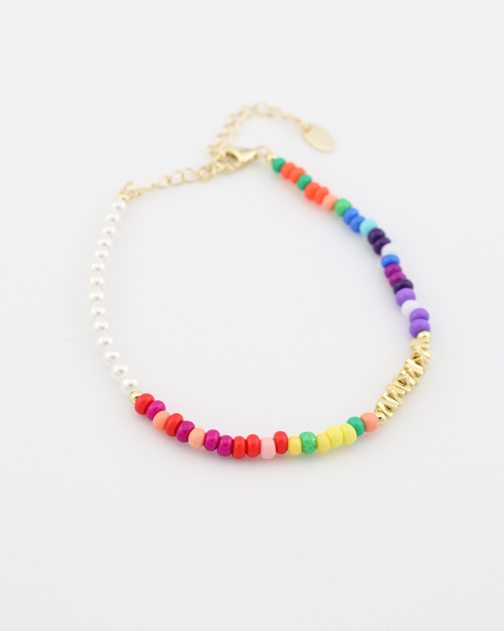 Colorful beaded bracelet with gold chain on a white background