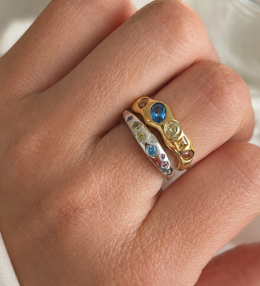 Yumi Ring worn on the hand, styled as part of a ring stack