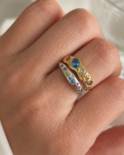 Yumi Ring worn on the hand, styled as part of a ring stack