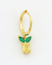 Gold hoop earring with green gemstones on a white background