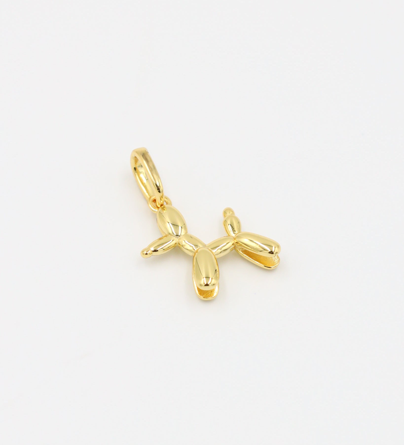 Gold-plated sterling silver balloon dog pendant, front view.
