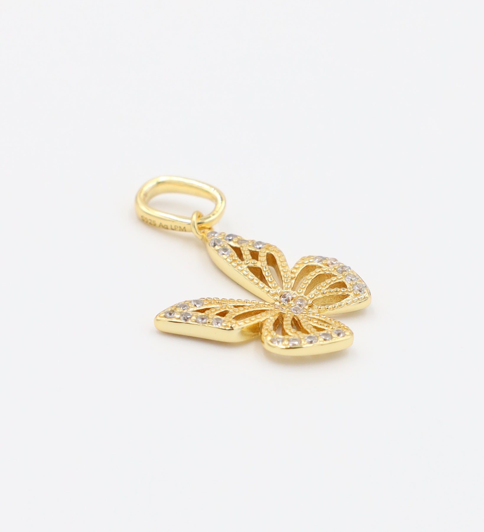 Side view of the Butterfly Gold pendant made from gold-plated 925 sterling silver with zirconia stones.