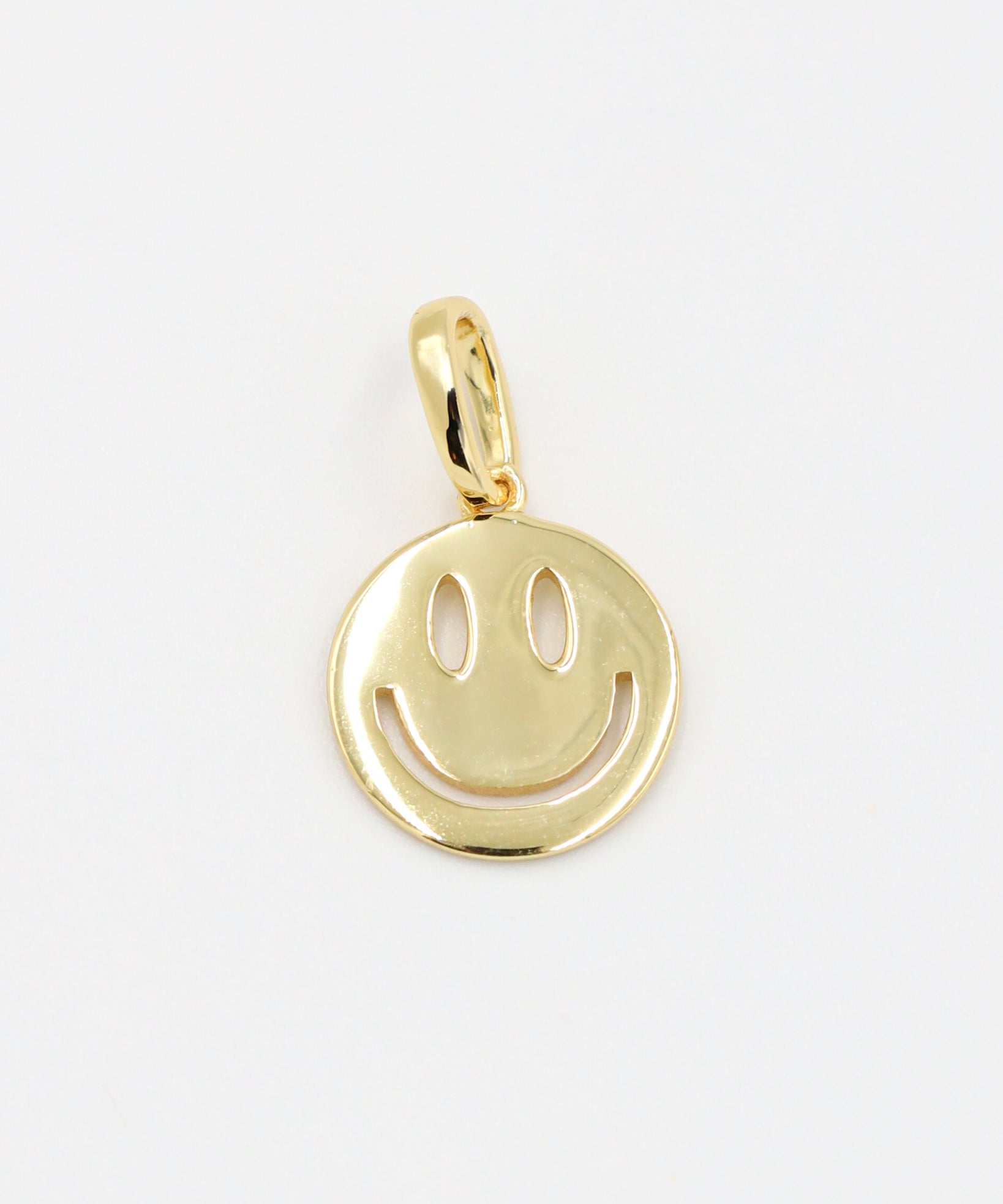 Flynn Gold smiley face pendant crafted in gold-plated 925 sterling silver, shown as a single piece.