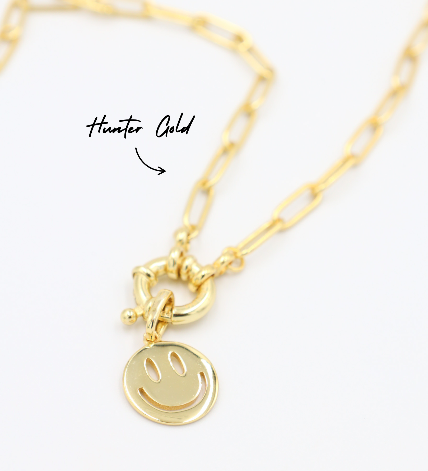 Close-up of Hunter Gold chain necklace featuring Flynn Gold smiley face pendant in gold-plated 925 sterling silver.