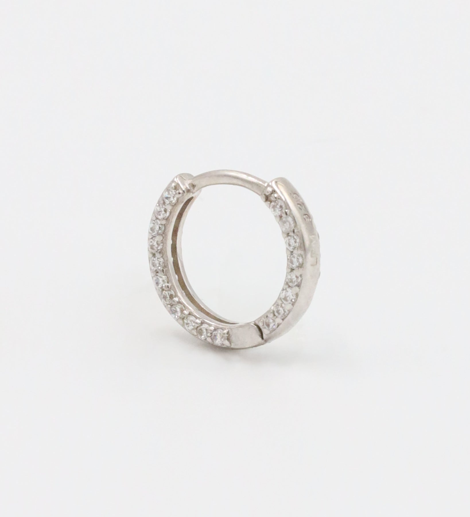 Stylish Mara sterling silver hoop earring featuring sparkling zirconia stones, designed for everyday elegance.
