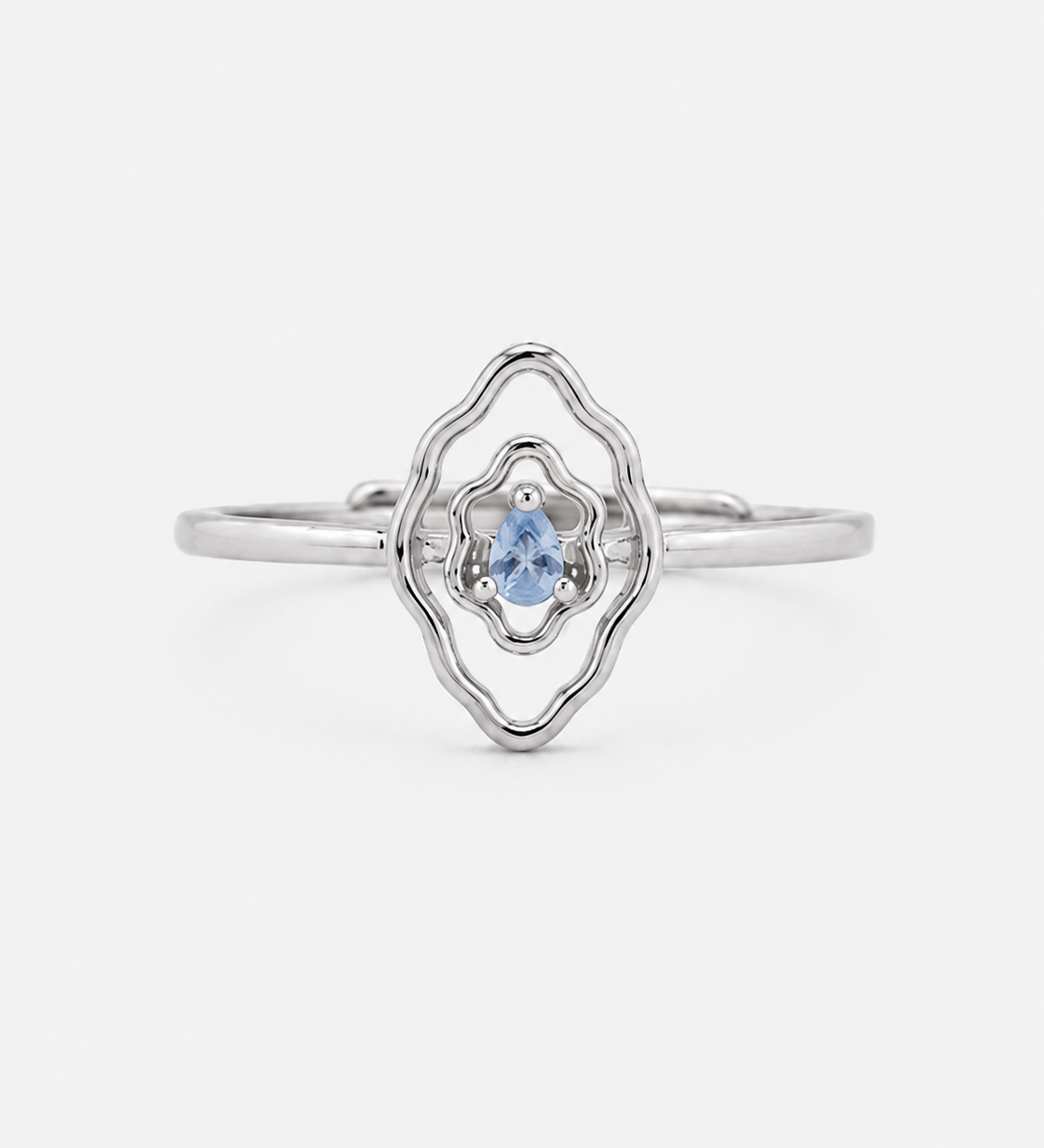 Mumu Ring in 925 sterling silver with a vulva-inspired design and blue teardrop-shaped stone