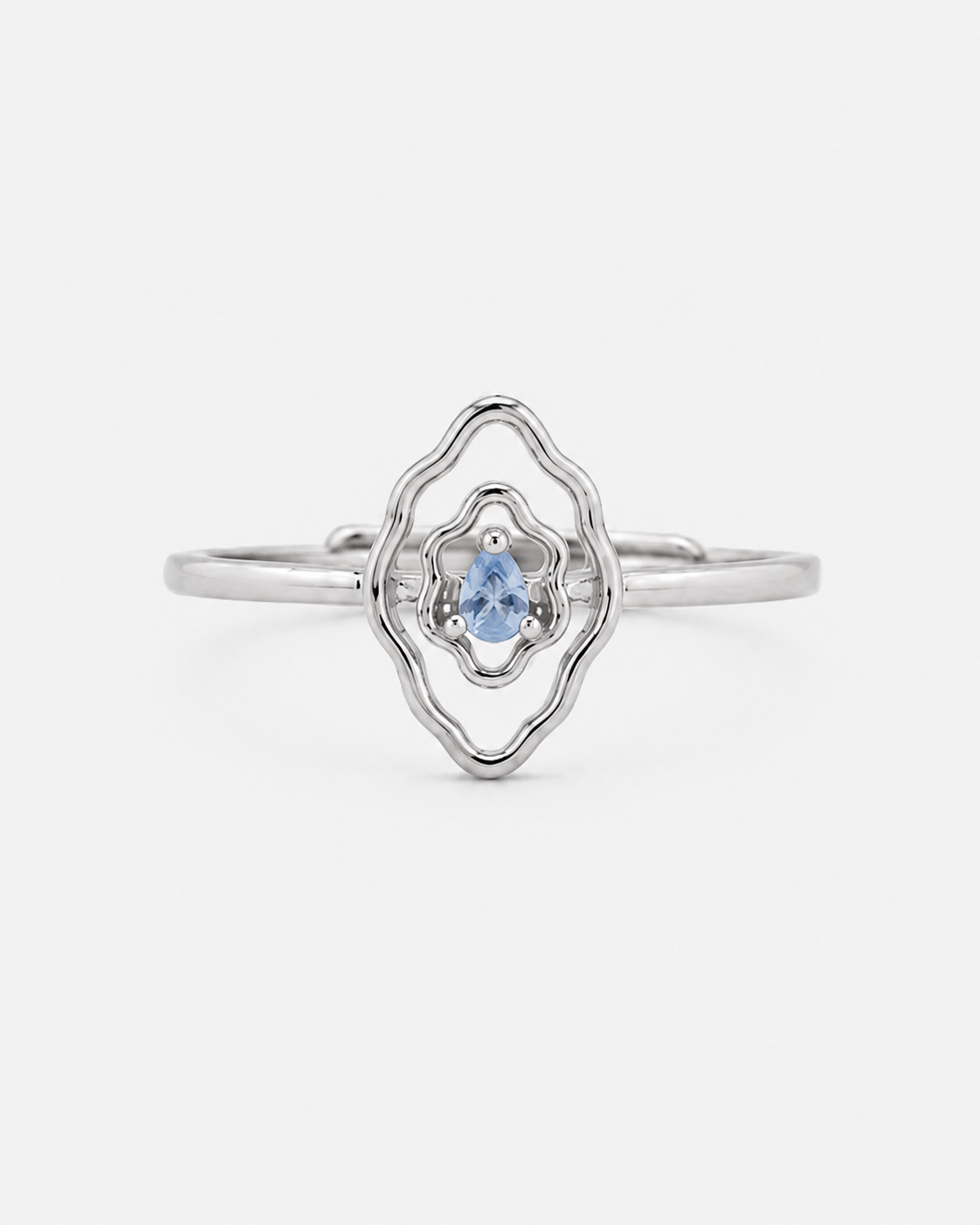 Mumu Ring in 925 sterling silver with a vulva-inspired design and blue teardrop-shaped stone