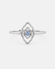 Mumu Ring in 925 sterling silver with a vulva-inspired design and blue teardrop-shaped stone