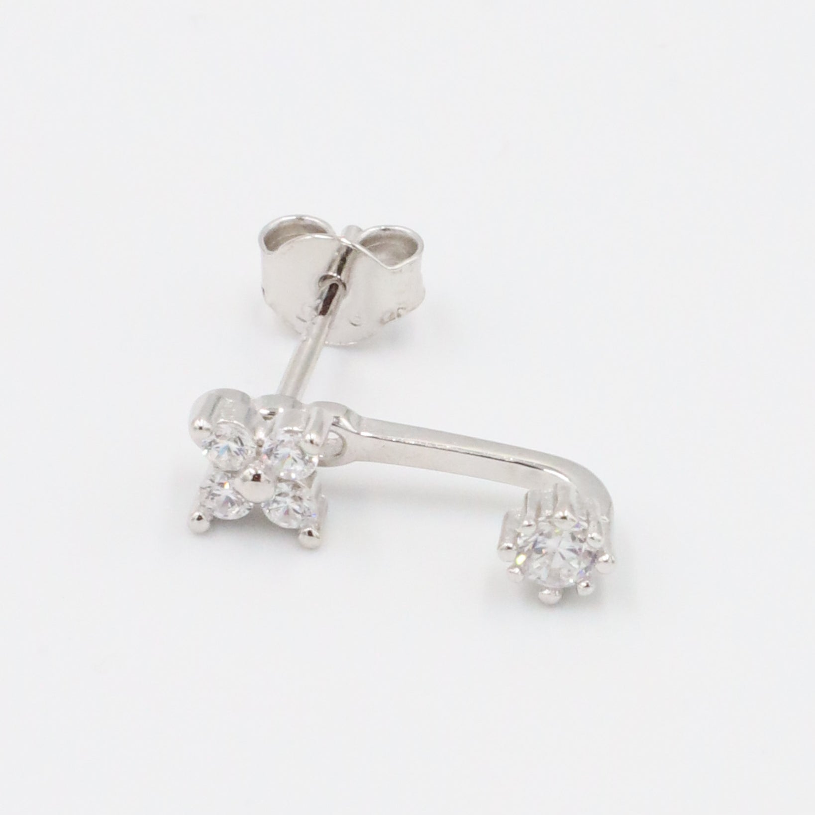 Sterling silver stud earring for the left ear with sparkling zirconia stones.